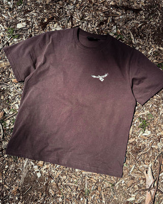 inga linga the echidna t-shirt in washed chocolate color in a front detailed image displaying murrundindi eagle logo.